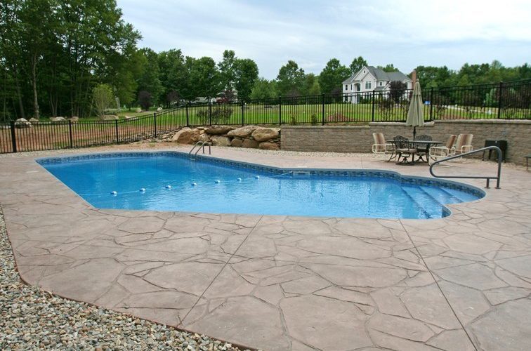 This is a picture of a Custom Lazy L Inground Pool installed by julianos