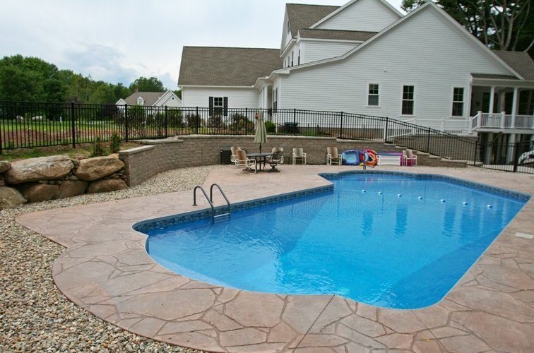This is a picture of a Custom Lazy L Inground Pool installed by julianos