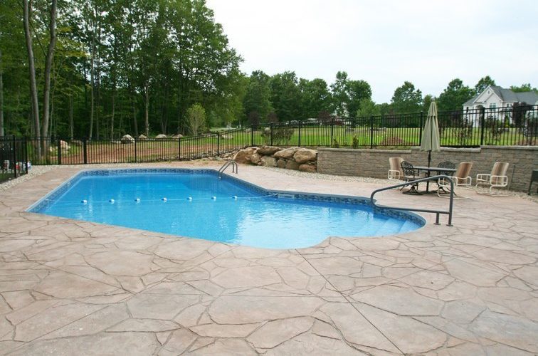 This is a picture of a Custom Lazy L Inground Pool installed by julianos