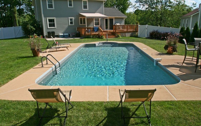 This is a photo of a patrician in ground pool in Germantown, NY with custom pavers and steps.